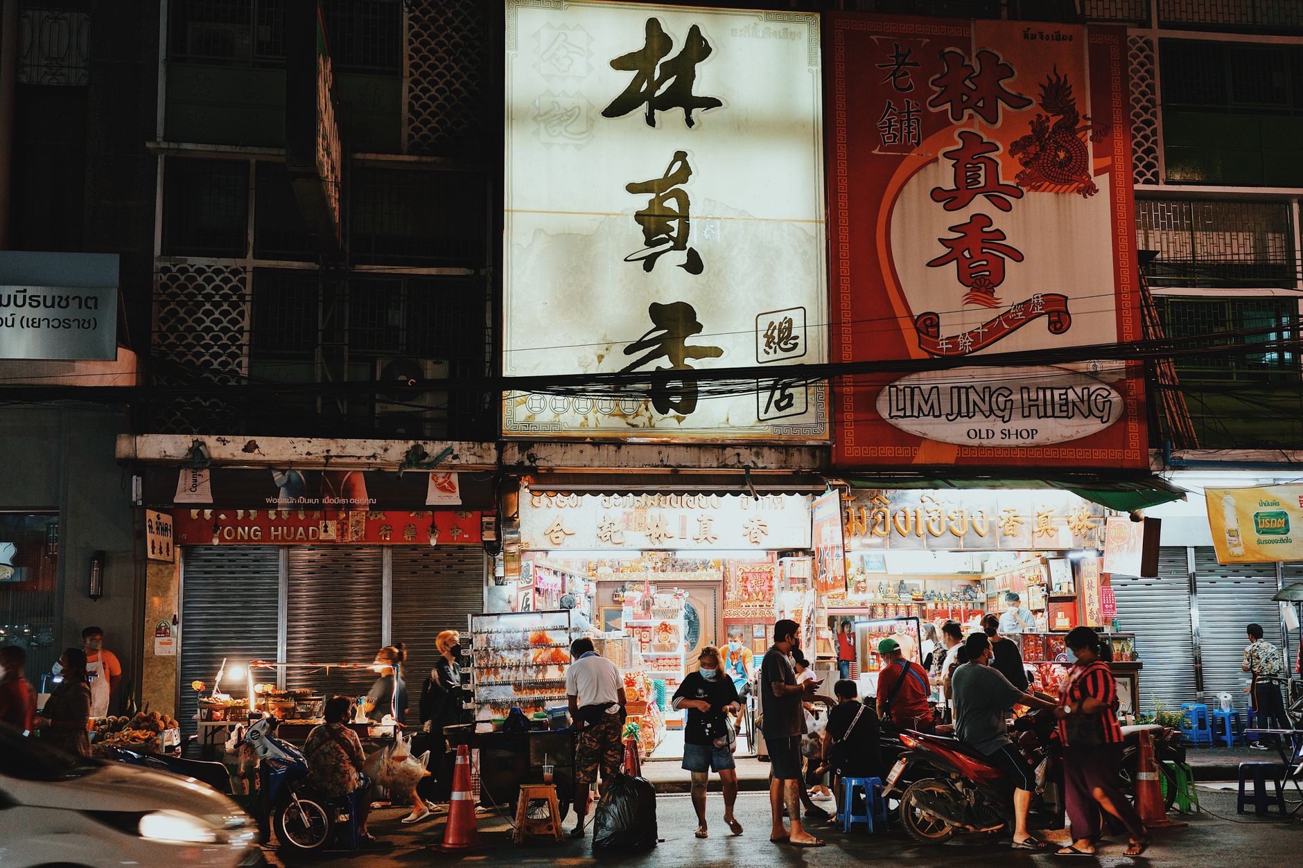 Busy but safe Sukhumvit street scene at night in Bangkok.