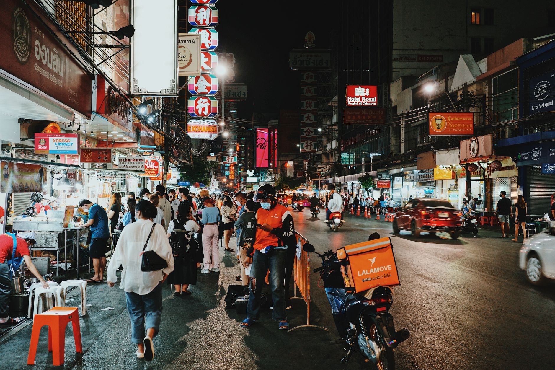 Khao San Road at night with neon signs and street food stalls
