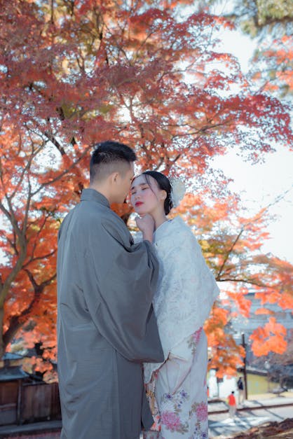 A Couple in Traditional Kimonos Kissing · Free Stock Photo