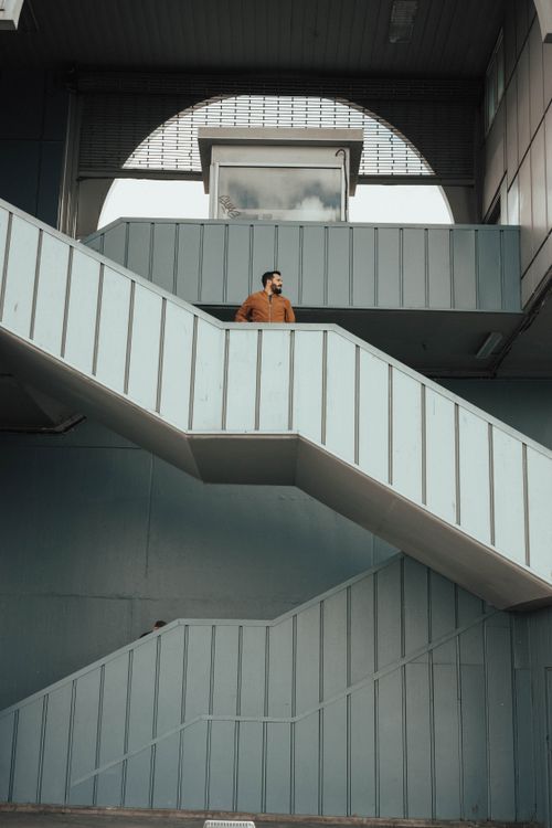 Free A man standing on a modern staircase in İstanbul, Turkey. Stock Photo