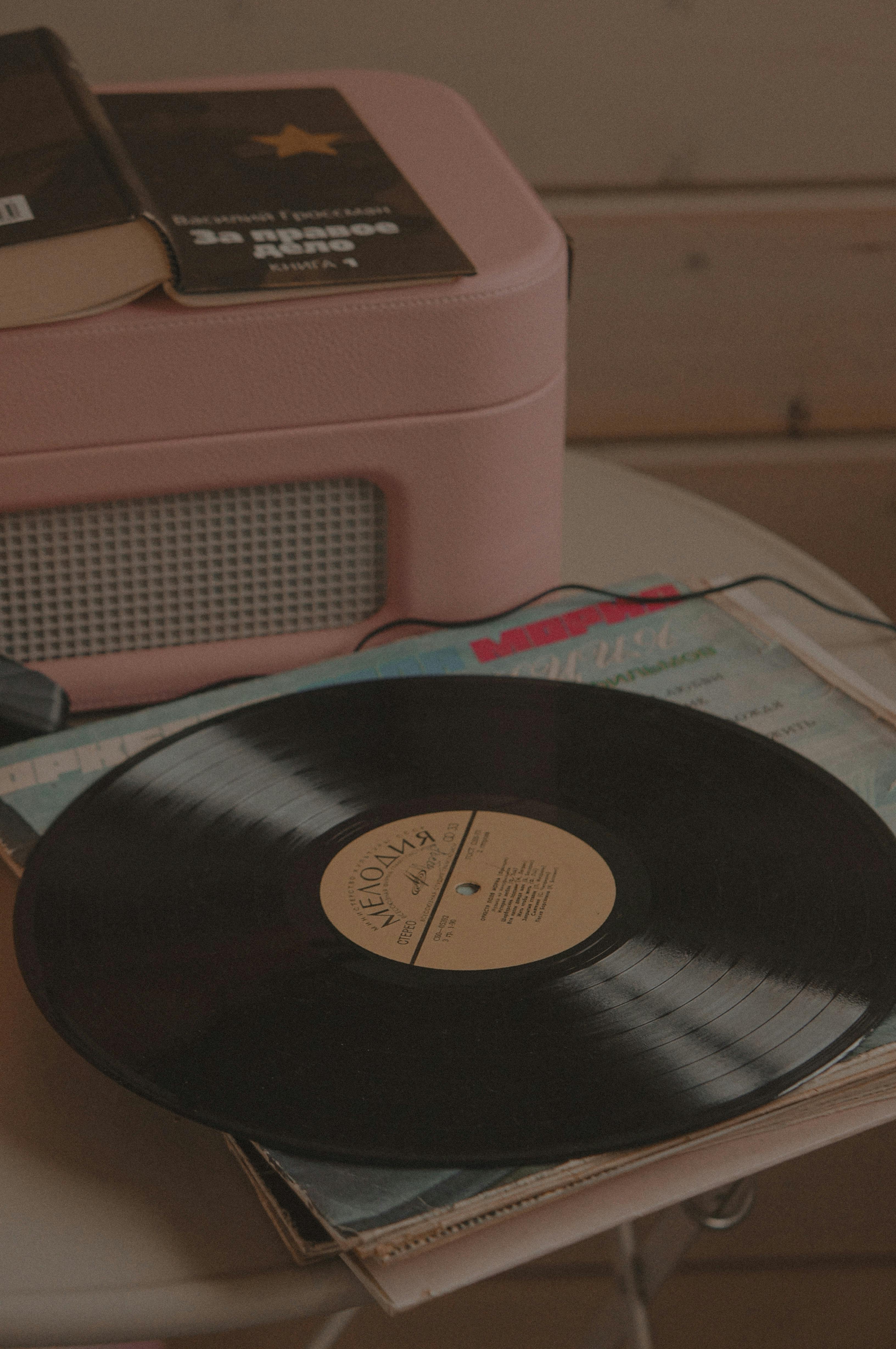 A Vinyl Record On Vinyl Cover · Free Stock Photo