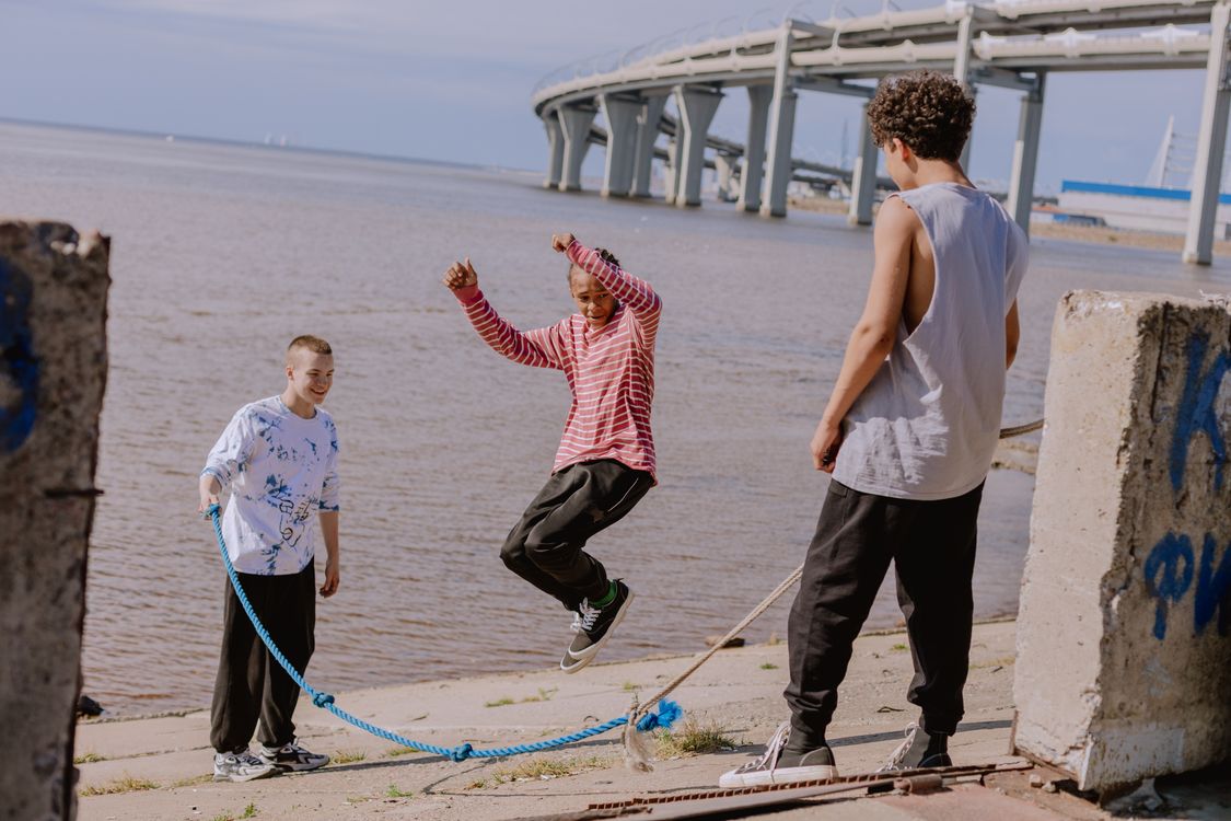 A Group of Young Men Playing Jump Rope · Free Stock Photo