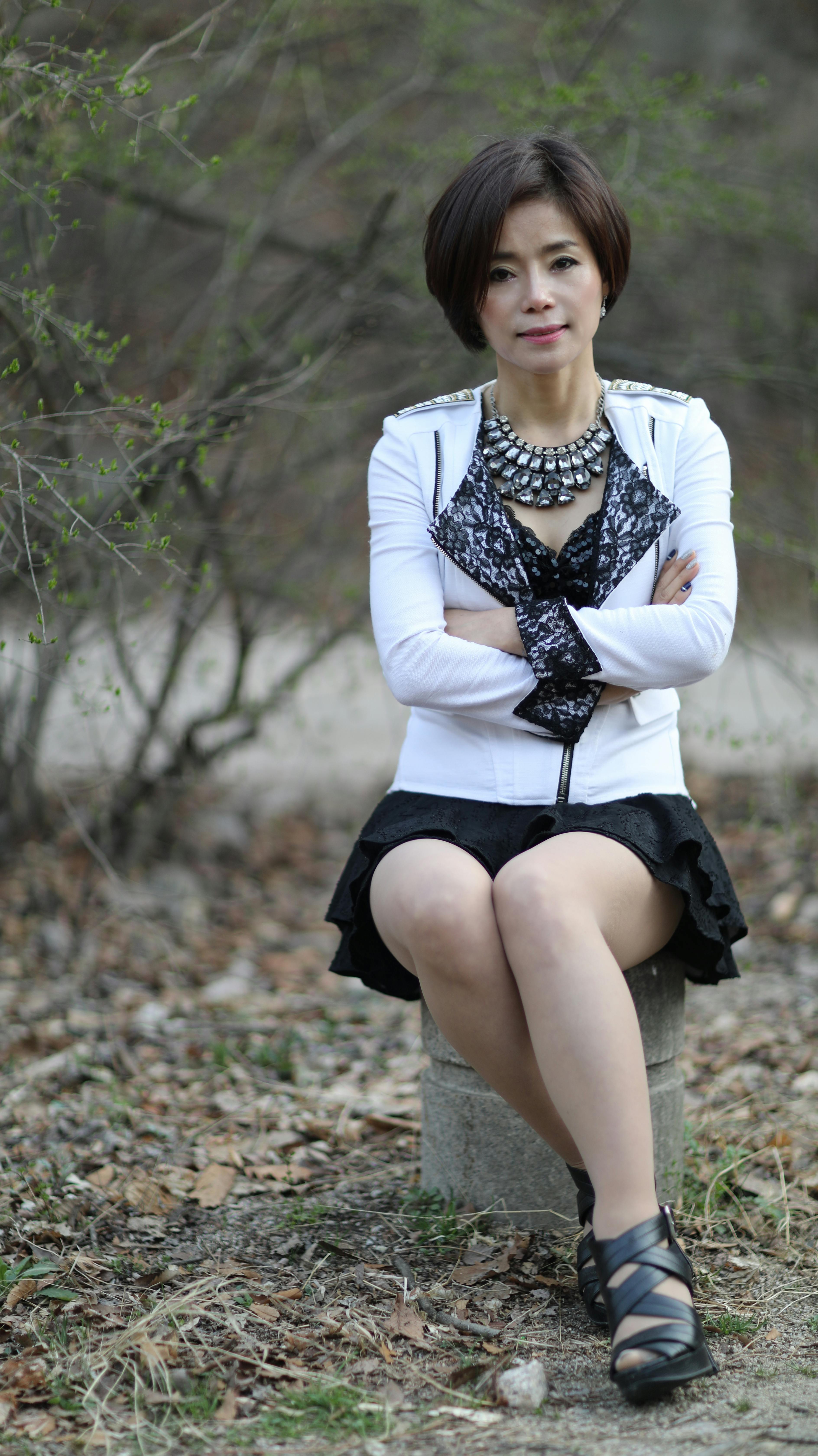 Woman Wearing a White Blouse and a Black Skirt · Free Stock Photo