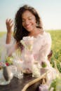 Smiling Woman Sitting at Table and Creating Flavours and Fragrances