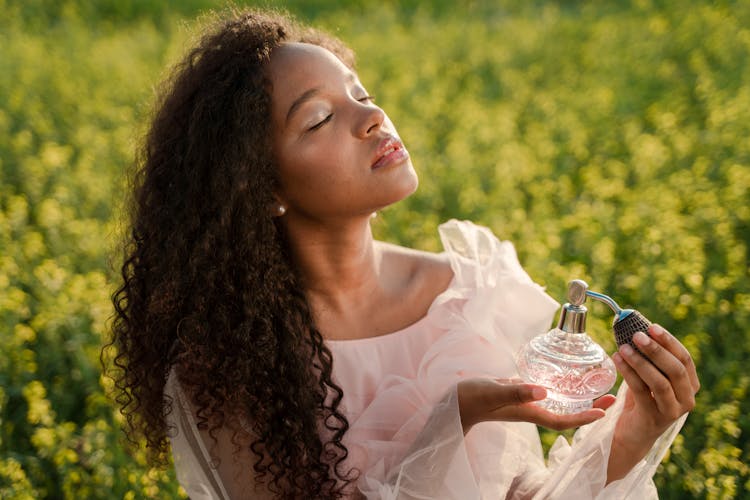 Woman With Perfume Bottle