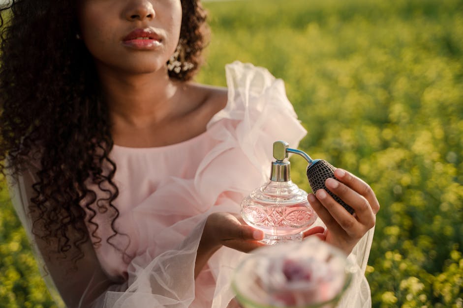 Woman Smelling Perfume Stock Photo, Picture and Royalty Free Image. Image  6611204.