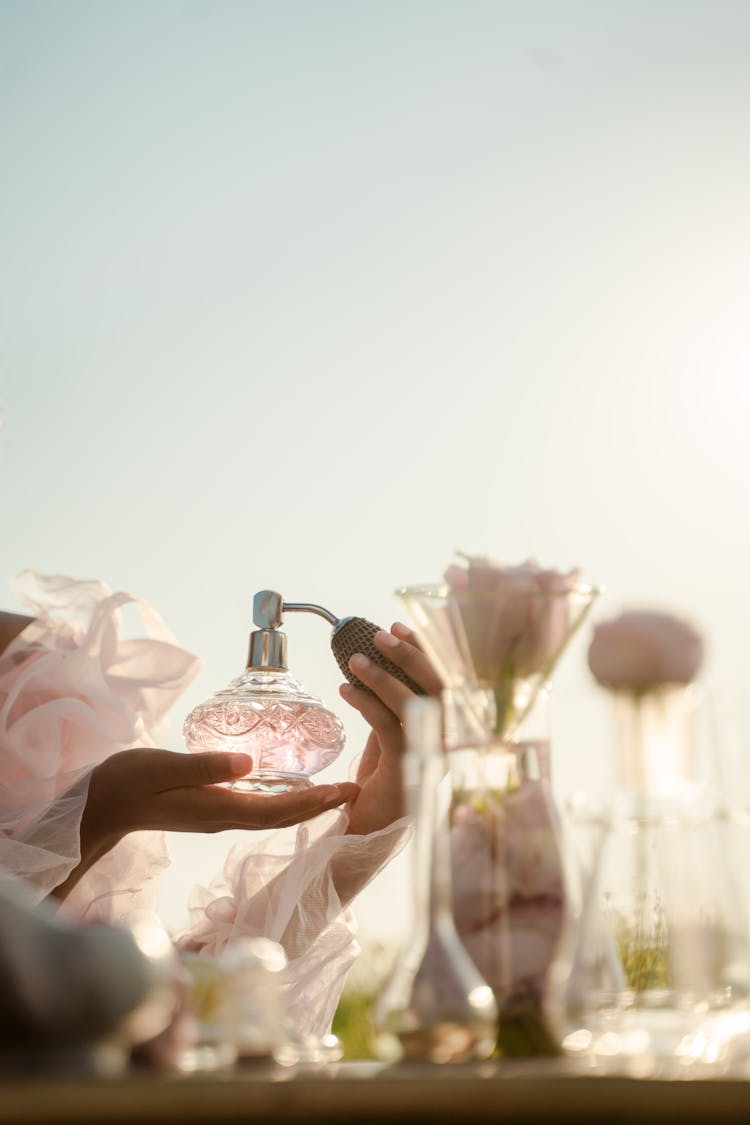 Woman Holding Perfume Bottle