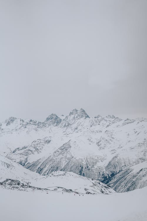 Free Mountain peaks covered with snow  Stock Photo