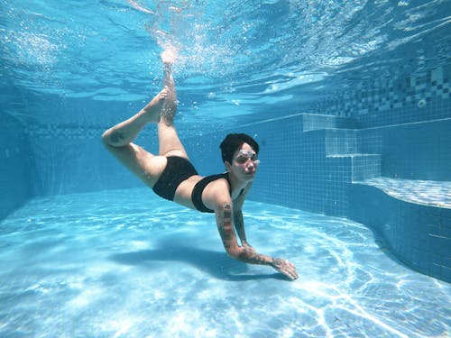 Woman Diving in Swimming Pool