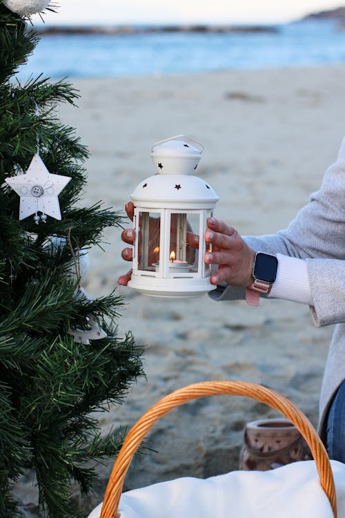 Free A Person Holding a Candle Lantern Stock Photo