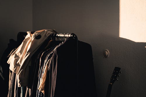 Variety of Clothes Hanging on a Rack