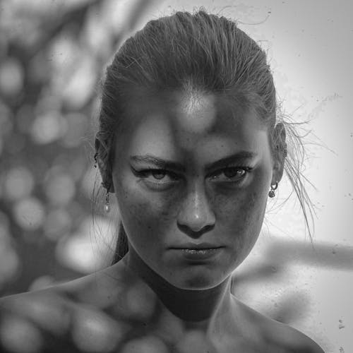 Free Grayscale Portrait of a Woman with Freckles Stock Photo