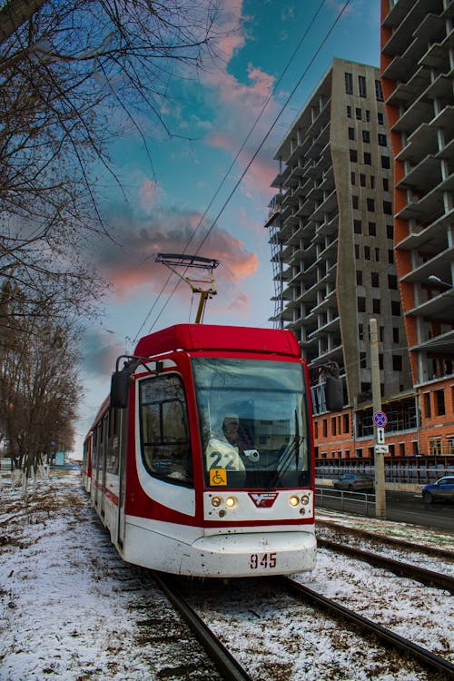 Train Passing in Front of the Concrete Buildings