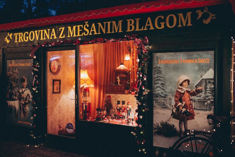 Wooden Storefront With Glass Window Displaying Toys