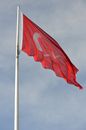 Red and White Flag Blowing in the Wind