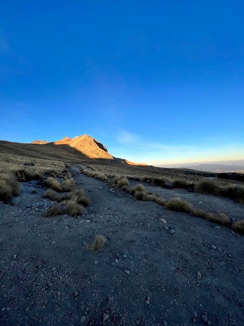 Brown Mountain Under Blue Sky