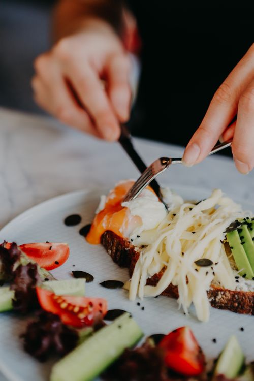 Free Delicious avocado salmon toast with salad, captured in a close-up view. Perfect for gourmet food enthusiasts. Stock Photo
