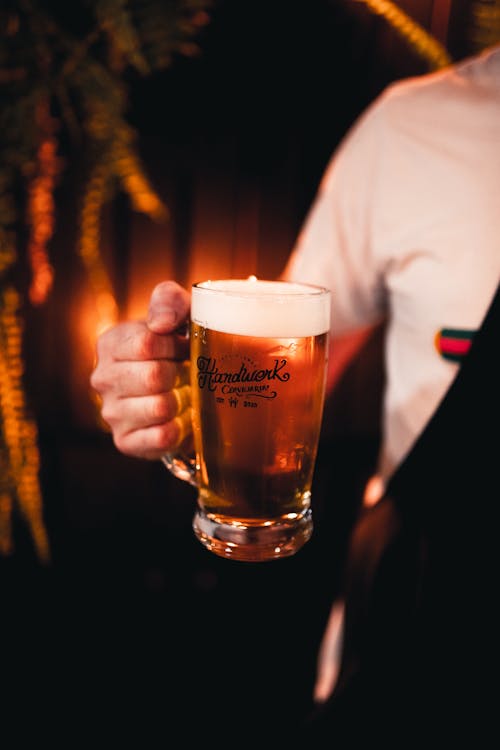 Free Close-Up Shot of a Person Holding a Beer Mug Stock Photo