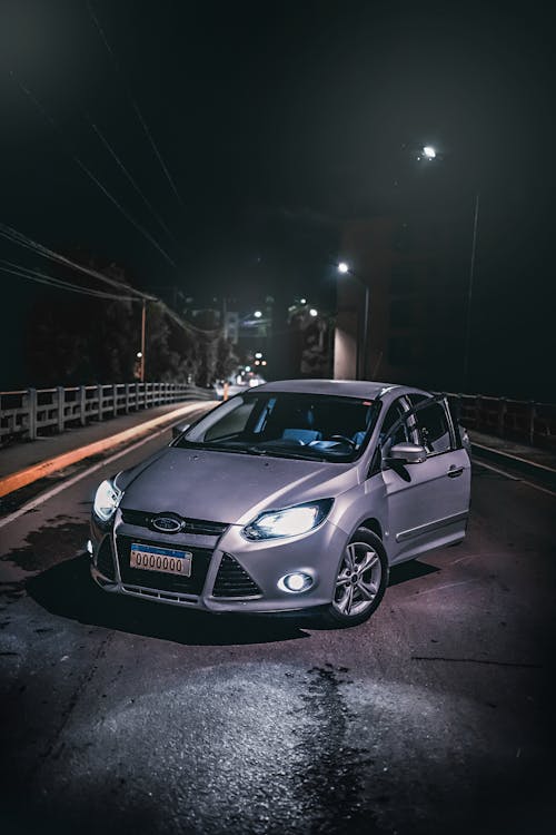 Free Silver Car on Concrete Bridge During Night Time Stock Photo