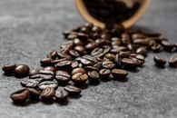 Close Up Photo of Coffee Beans on Gray Surface