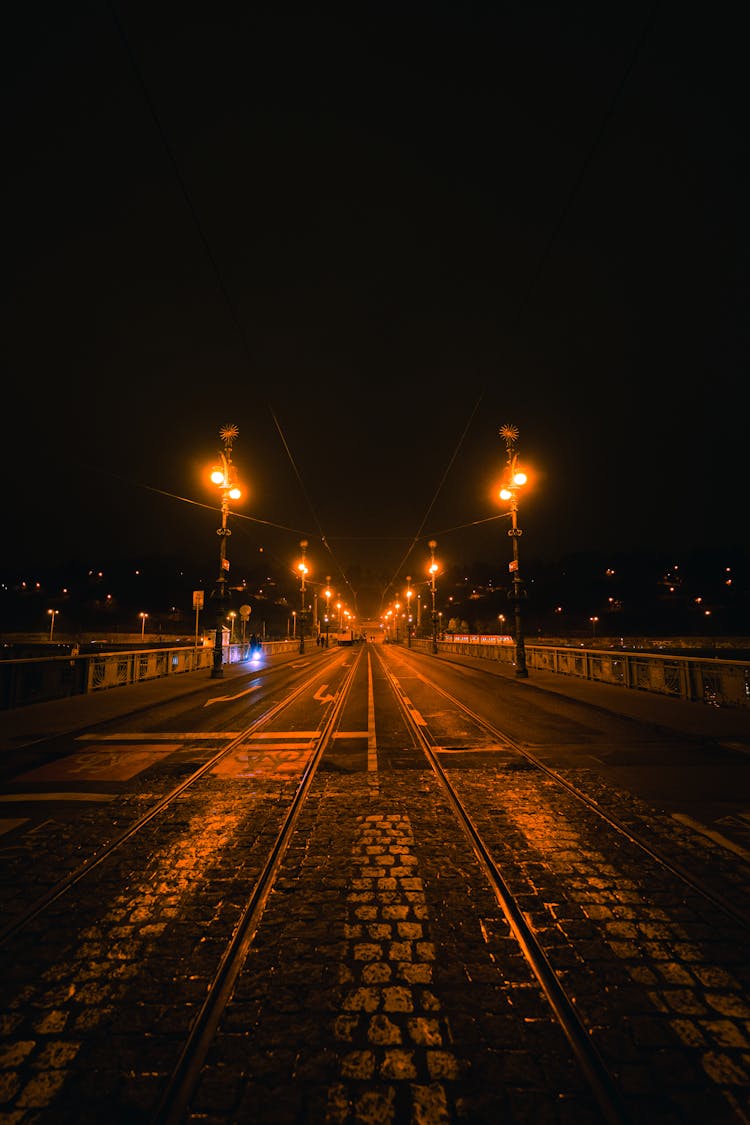 Symmetrical View On City Bridge At Night