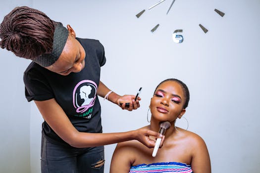 A makeup artist skillfully applies cosmetics to enhance her client's beauty in a salon setting.
