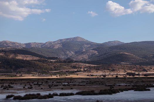 Brown and Green Mountains Under Blue Sky