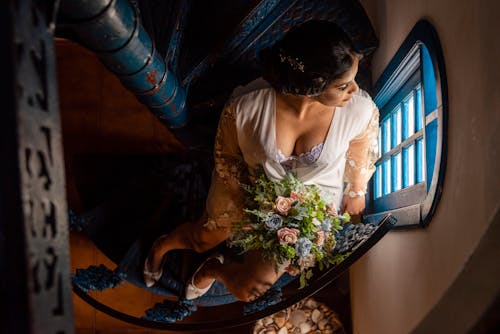 Overhead Shot of a Woman Holding a Bridal Bouquet