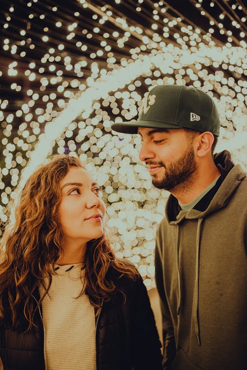 Fairy Lights Background of a Couple Standing Together