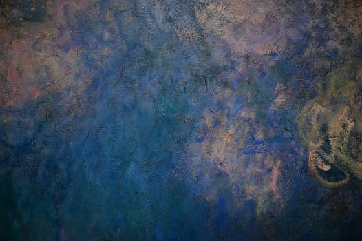 Dark textured abstract painting with rich blue hues, creating a moody atmosphere.