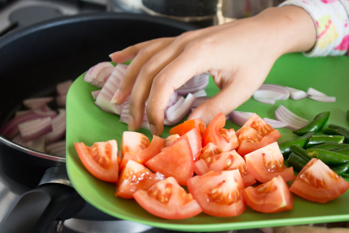 Person Holding Tomato