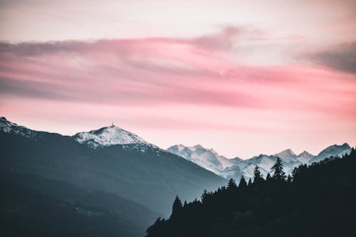 Free Snow Capped Mountains Under the Cloudy Skies Stock Photo