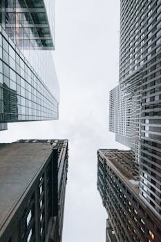 A stunning upward view of towering skyscrapers with a modern architectural style.