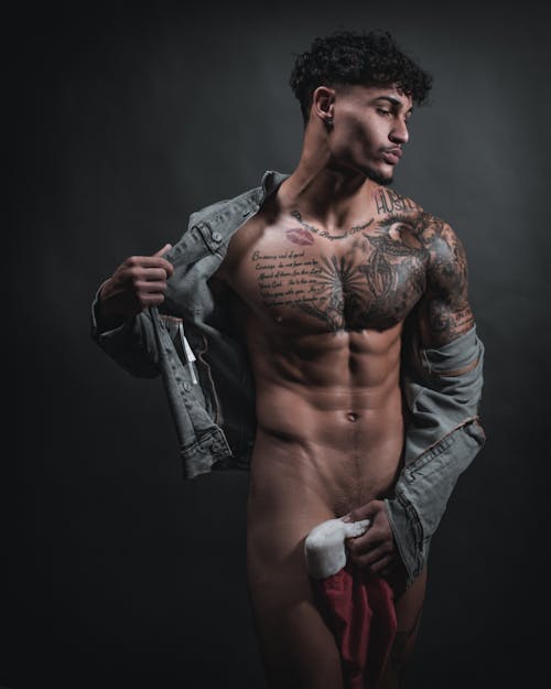 Free Naked Man with Tattoo Wearing Gray Denim Jacket Stock Photo