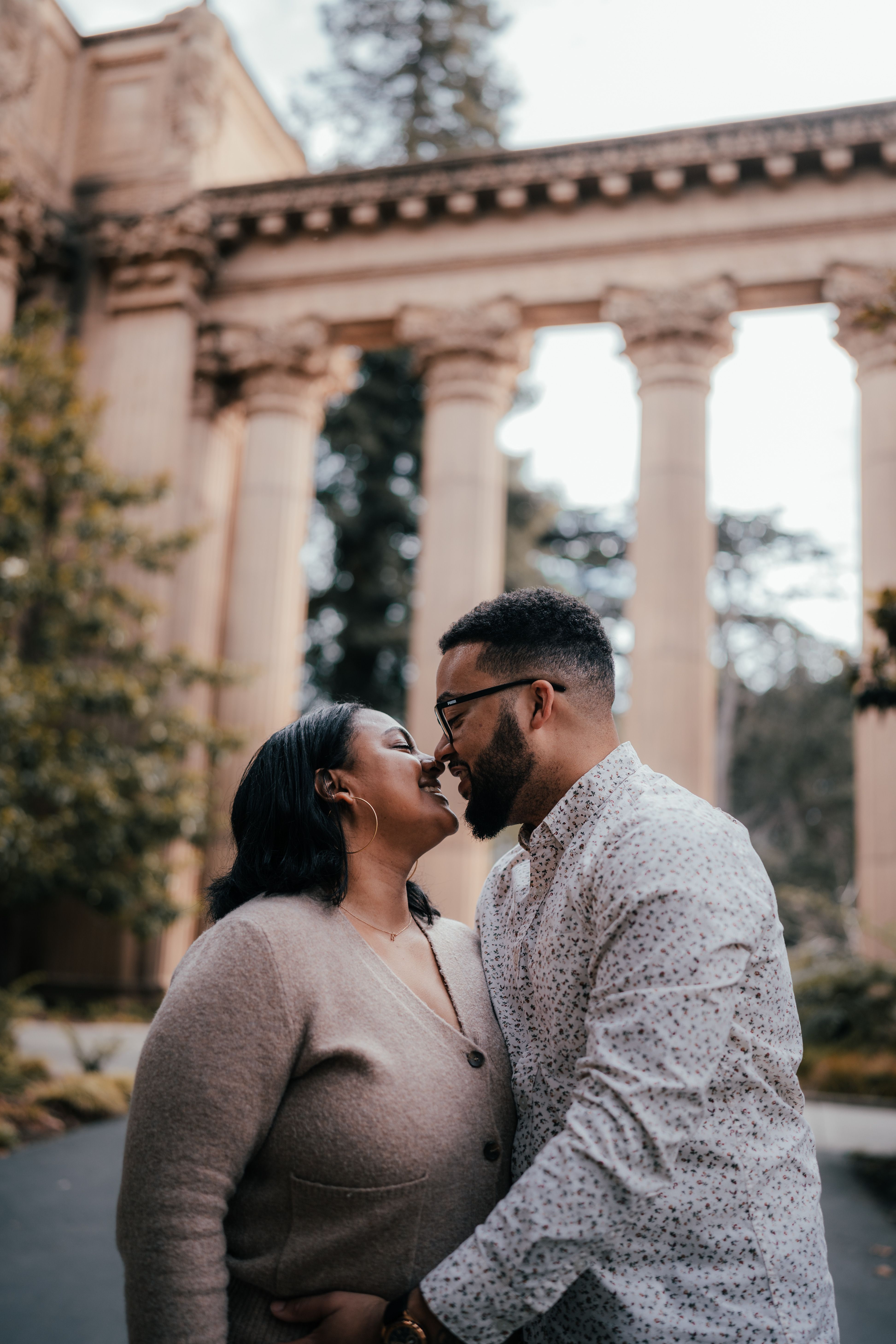 Couple in Traditional Clothing Hugging and Kissing · Free Stock Photo
