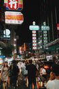 People Walking on Street during Nighttime