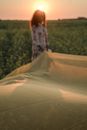 Woman Carrying Yellow See-Through Fabric