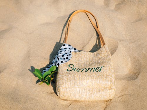 Woven Shoulder Bag with a Scarf on the Sand