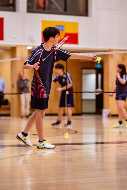 A Boy Playing Badminton