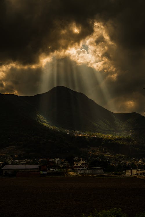 Dramatic Sky over Town and Mountain