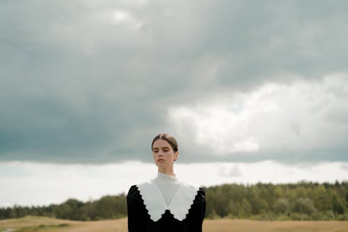 Pensive Woman in Countryside