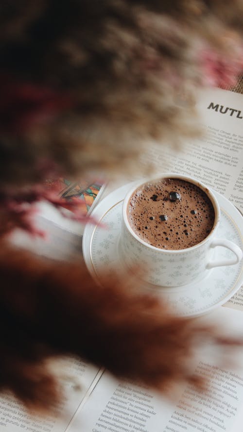 Free Cup of Hot Chocolate on Book Page Stock Photo