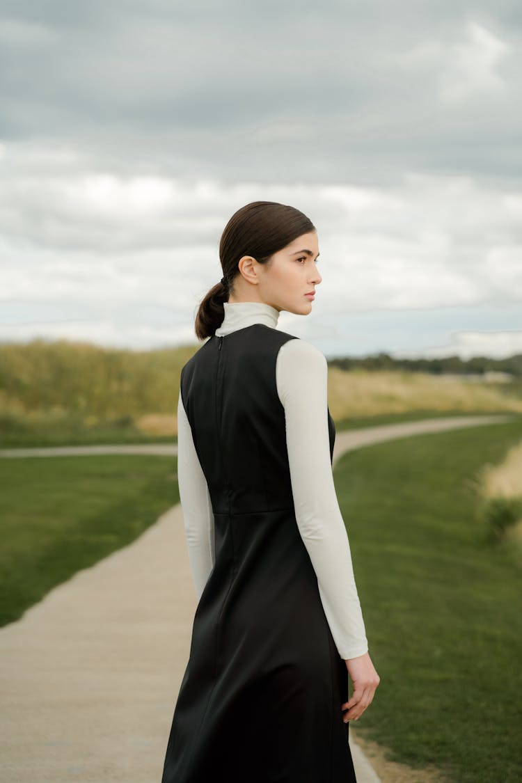 Young Woman In Black And White Long Sleeve Dress