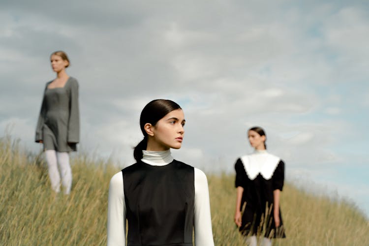 Women Standing On A Hill