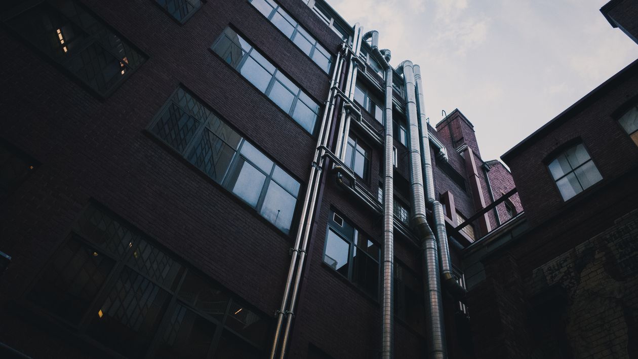 Gray Wall Painted Mid-rise Building · Free Stock Photo