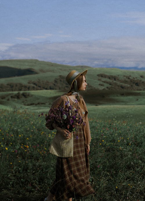 Woman in Vintage Clothes on Flower Field 