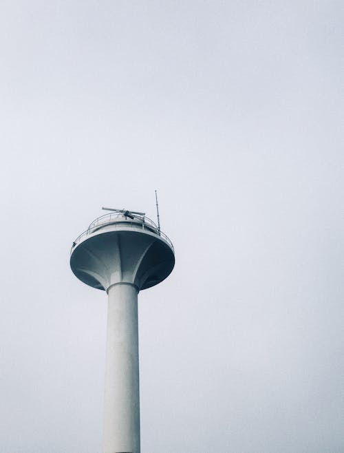 White and Gray Concrete Tower Under White Sky