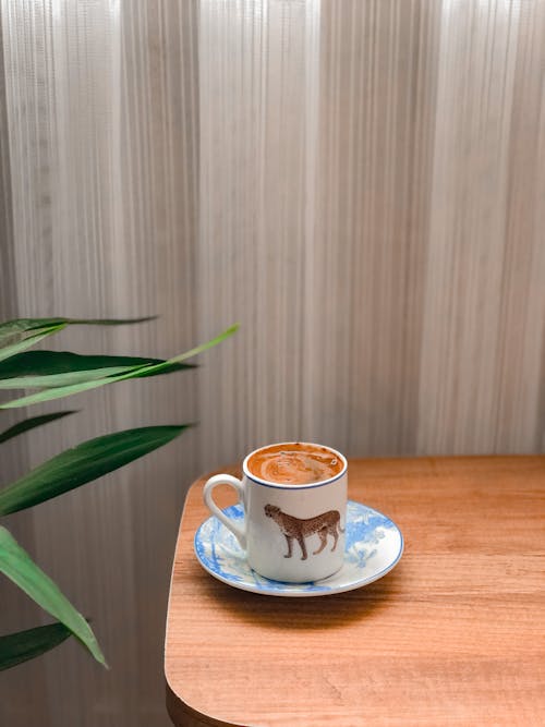 Free Photo of a Cup of Coffee on a Wooden Surface Stock Photo