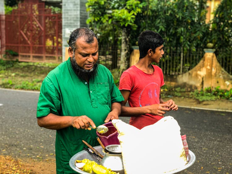 Father And Son Selling Street Food