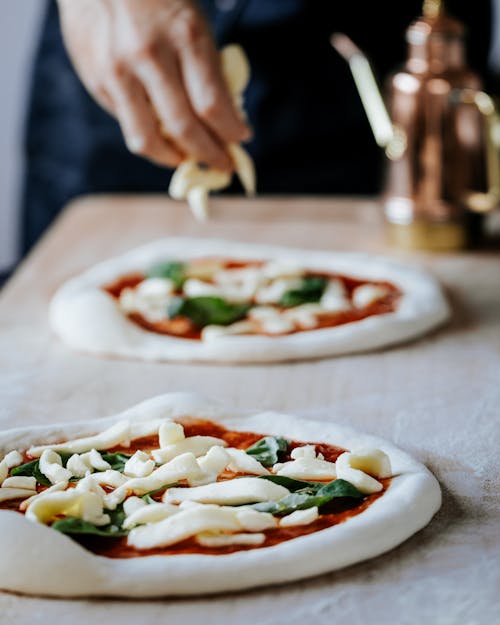 Close-up of Man Preparing Pizza 